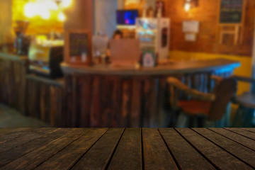 empty wooden table on on coffee shop background, with copy space