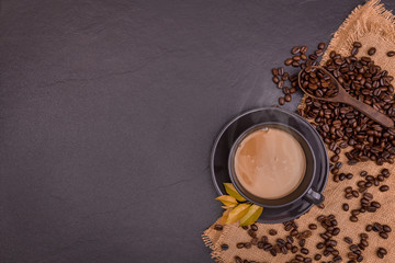 Coffee cup and beans ,top view with black background copy space