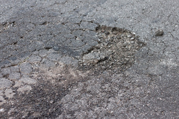 Asphalt floors are broken from non-standard construction.
