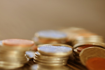 Row of coins on wood background for finance and Saving concept,Investment, Economy, Soft focus and dark style.