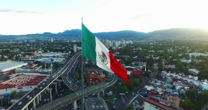 Aerial view of a huge mexican flag fluttering, Mexico City. TK8