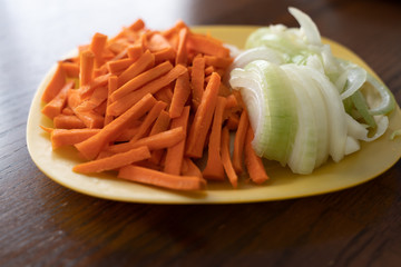 chopped Carrots and Onions on a plate
