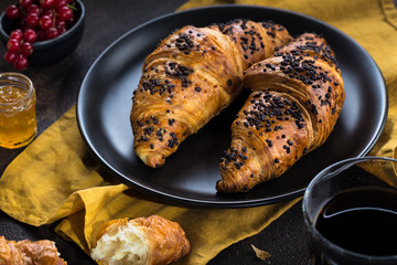 Continental breakfast. Coffee, orange juice, croissants, jam and butter. White stone background. 