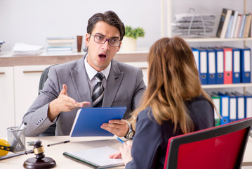 Lawyer talking to client in office