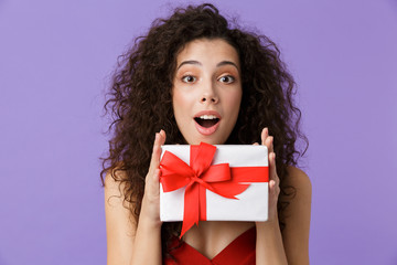 Portrait of a cheerful woman with dark curly hair