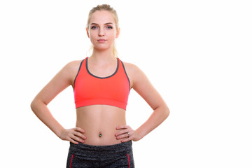 Studio shot of young beautiful teenage girl with hands on hips r