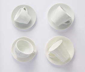 empty cup and saucer isolated on white