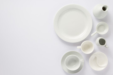 empty set of dishes on white  background