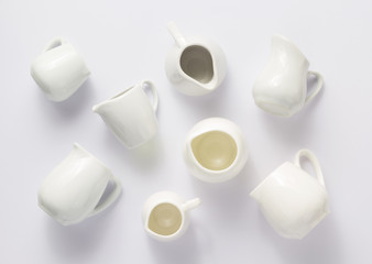 empty cream jug on white  background