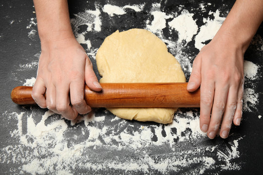 Woman hands in flour make dough. Knead bakery, prepare pizza.