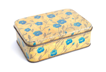 Vintage Metal box for monpansier isolated on a wooden background.