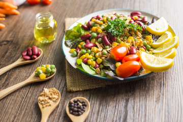 Fototapeta na wymiar Healthy food background : salad bowl on wooden table.