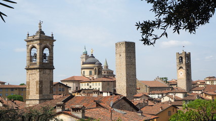 Fototapeta na wymiar Bergamo, Italy. The old town. Landscape at the city center, the old towers and the clock towers from the ancient fortress