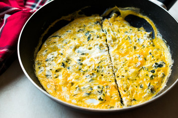 Half Cut Omelette with Cream Cheese and Chives in Pan.