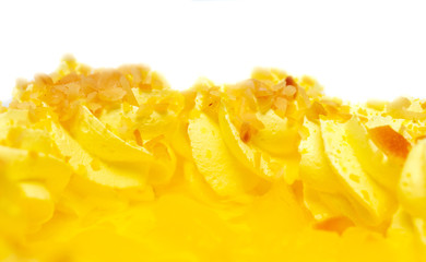 Cake with yellow pineapple cream on a white background