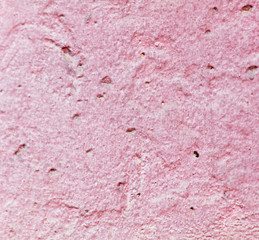Old wall painted with pink paint as a background