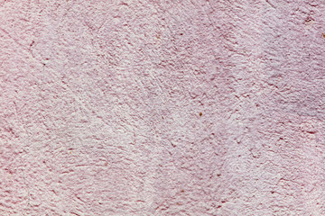 Old wall painted with pink paint as a background