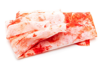 Napkin in red blood on white background