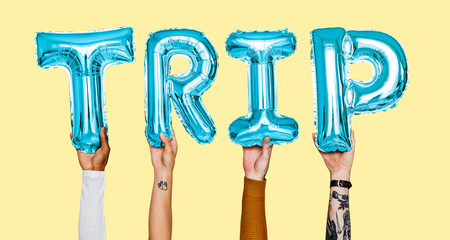 Hands showing trip balloons word
