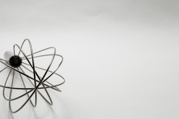 metal wire whisk on a white background close-up