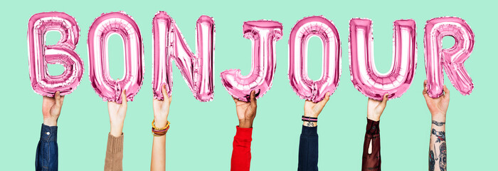Hands holding Bounjour word in balloon letters © Rawpixel.com