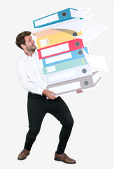Young businessman carrying a stack of binders - obrazy, fototapety, plakaty