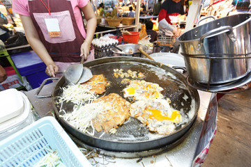 Oysters fried in egg batter. Pan-fried crispy mussel with bean sprout. Crispy Mussel and Beansprout Pancake