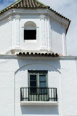 Stylish balcony with a metal railing, solid architectural element, a place of rest and relaxation, vintage decor