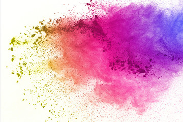 Freeze motion of colored powder explosions isolated on white background.