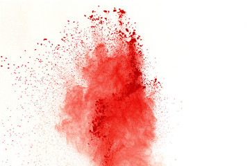 Red powder explosion on white background. Paint Holi.