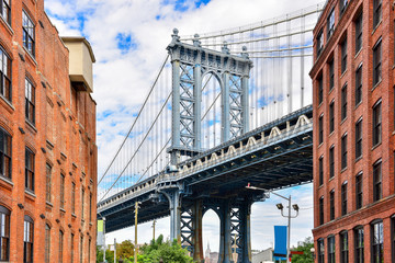 DUMBO district in Brooklyn. NEW YORK, USA. Dumbo is a neighborhood in the New York City borough of Brooklyn. Red buildings and Manhattan Bridge..