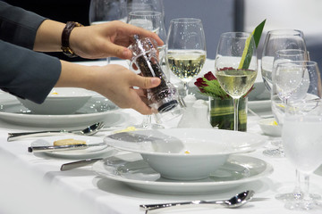 Table side fine dining service in restaurant, Waiter serving dishes to the table