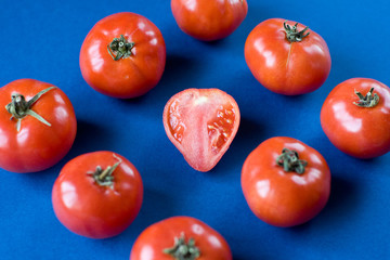 Red tomatoes in the section on blue background