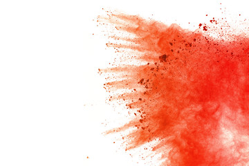 Red powder explosion on white background. Paint Holi.