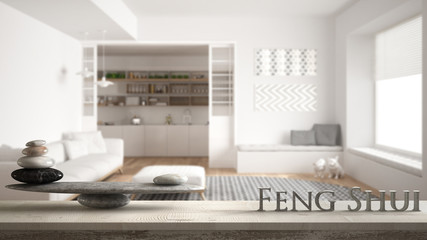 Wooden vintage table shelf with stone balance and 3d letters making the word feng shui over...