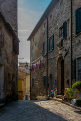 Fototapeta na wymiar Colorful narrow streets in the medieval town of Guardistallo in Tuscany - 5