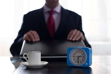 Businessman closes the laptop