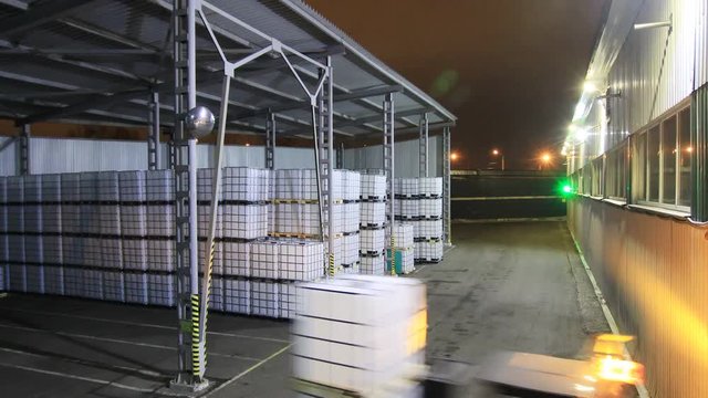 timelapse workers load plastic containers into lorry body