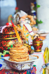 Appetizing pancakes for guests on the table at Shrovetide