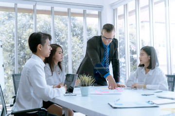 Young business people are presented marketing work project to the customer in meeting room office