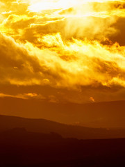 Sunset over a rolling hills in the landscape