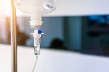 Close up of medical drip or IV drip chamber in patient room,Healthcare concept,  Selective focus.