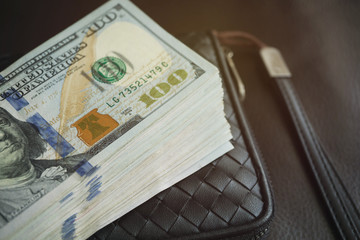 Close up of dollars on pocket bag with Instagram tone.