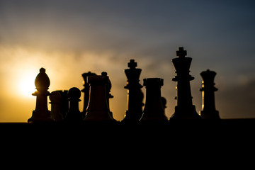 Fototapeta na wymiar chess board game concept of business ideas and competition and strategy ideas. Chess figures on a chessboard outdoor sunset background.