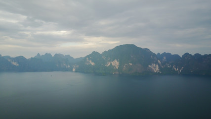 Aerial Khao Sok National Park with jungle and Clouds