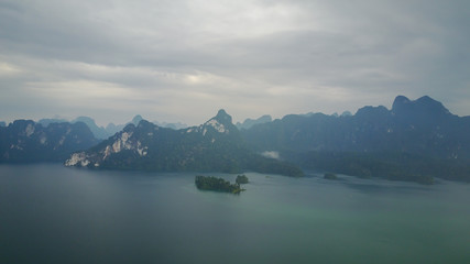 Aerial Khao Sok National Park with jungle and Clouds