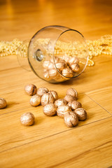 Golden nuts on the huge wineglass. Christmas and New Year