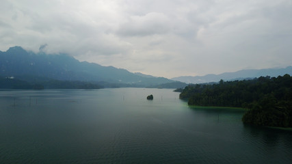 Aerial Khao Sok National Park with jungle and Clouds