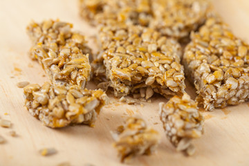 broken gozinaki from sunflower seeds on the Wooden board
