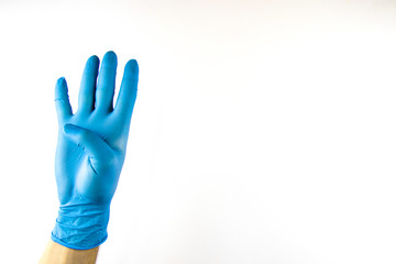 Male hand in medical glove on white background.